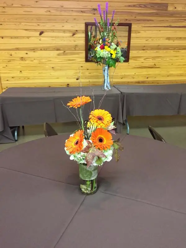 orange fall wedding flowers by kacie cooper floral designer tables