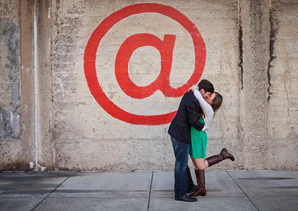 couple kissing in engagement photos 