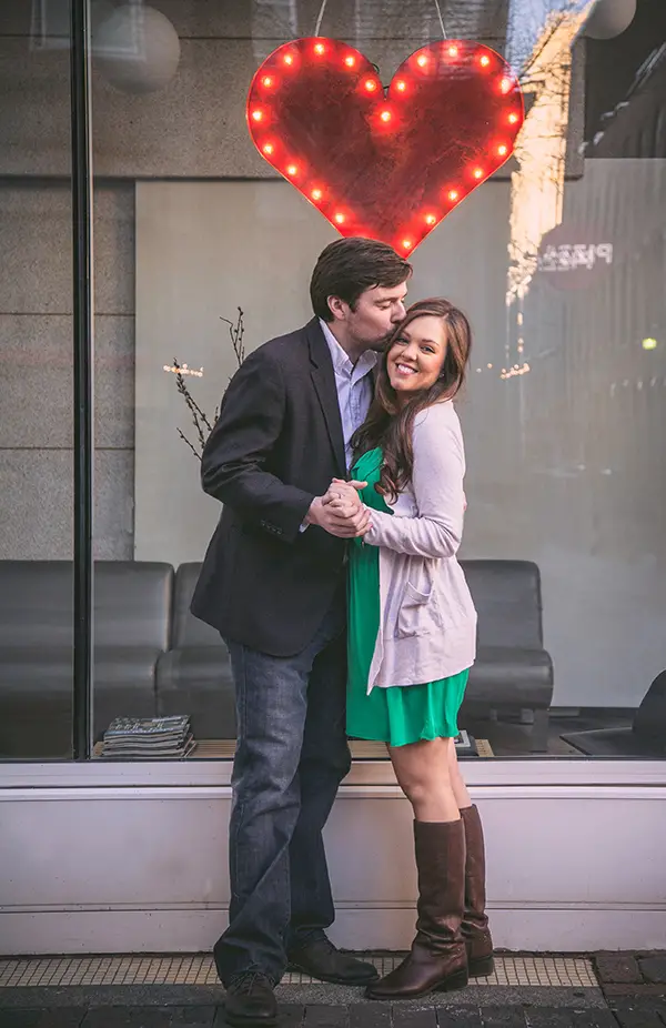engagement photos in front of light up heart