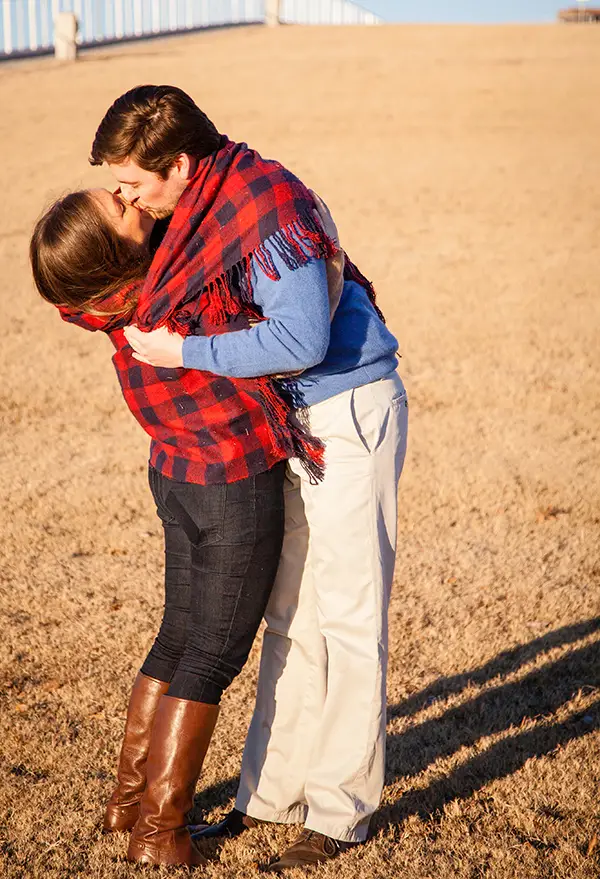 couple kissing by Beale Street Landing in Memphis