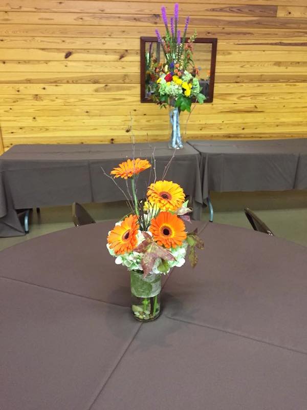 orange fall wedding flowers by kacie cooper floral designer tables