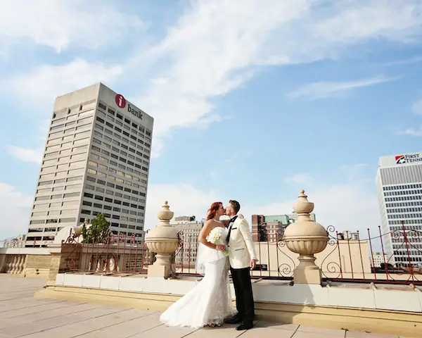 bride and groom on top of the peabody hotel in Memphis - Cindy B Thymius Photography, midsouthbride.com
