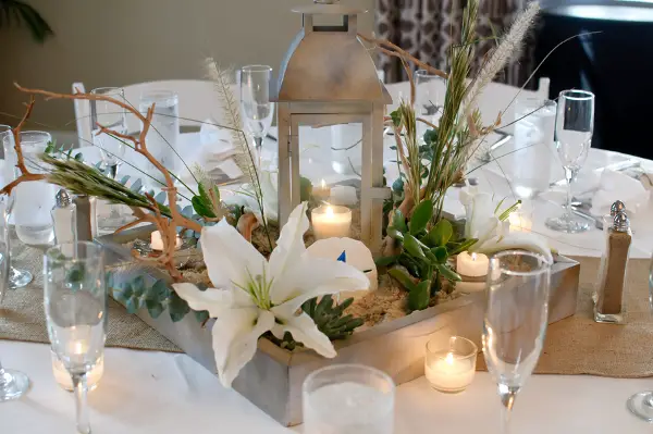 beach lantern wedding centerpiece - photo by Carrie Wildes Photography - midsouthbride.com