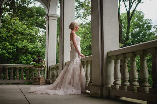 Ashlyn wearing a white wedding dress from low's Bridal