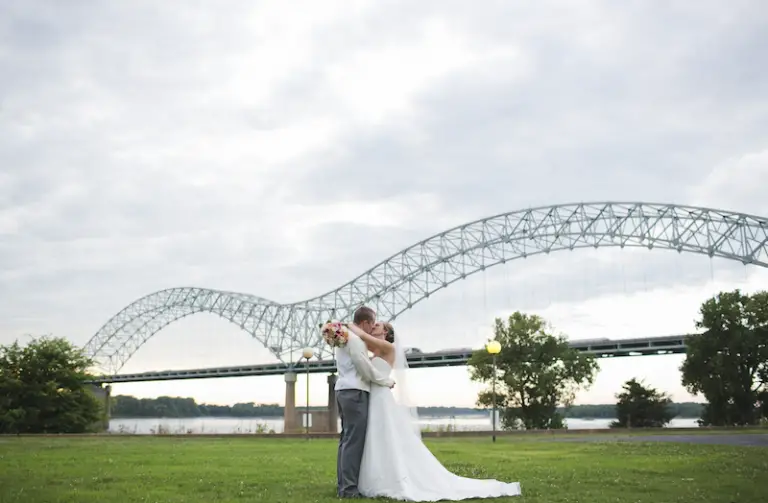 Mud-Island-Park-Memphis-Wedding-Venue-couple-in-front-of-the-M-bridge-photo-by-Kelly-Ginn-Photography