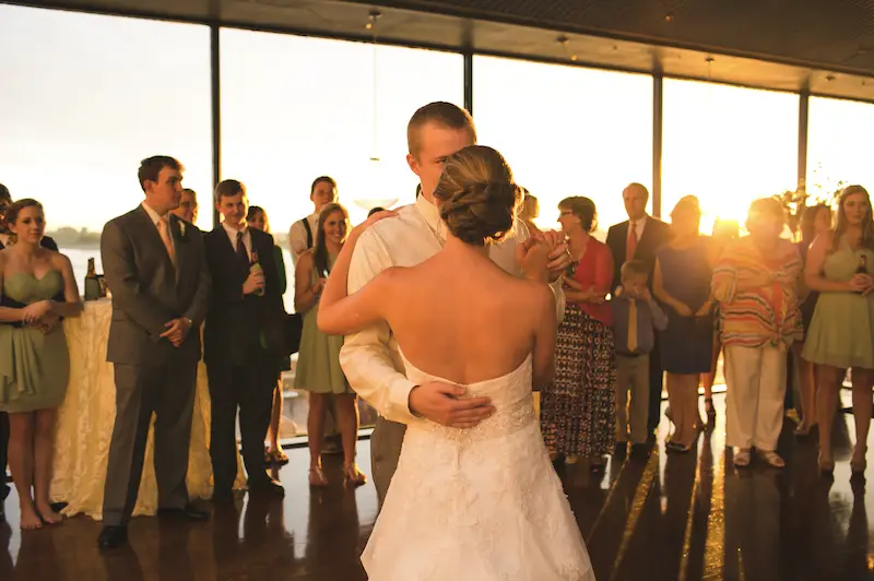 couple dancing at reception in front of window by the river at Mud Island Park Memphis Wedding Venue  photo by Kelly Ginn Photography