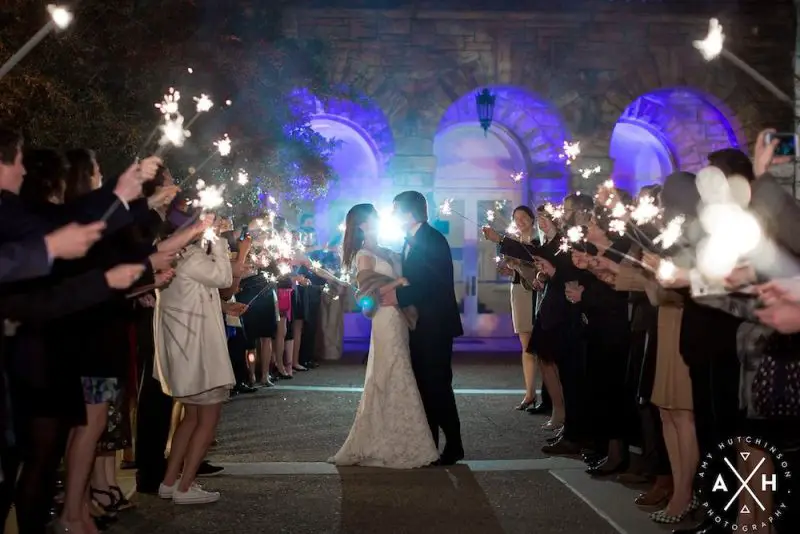 Dancing Kissing Couple Exit at Memphis Pink Palace Wedding - Photo by Amy Hutchinson Photography